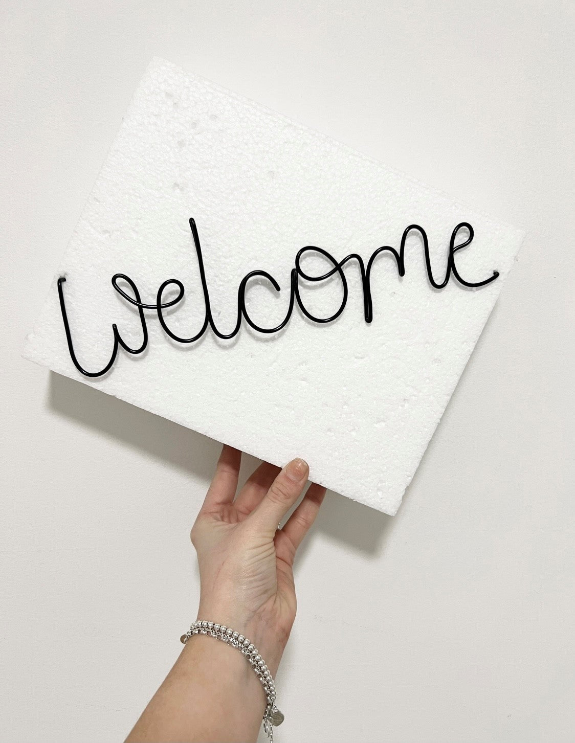 'Welcome' wire sign