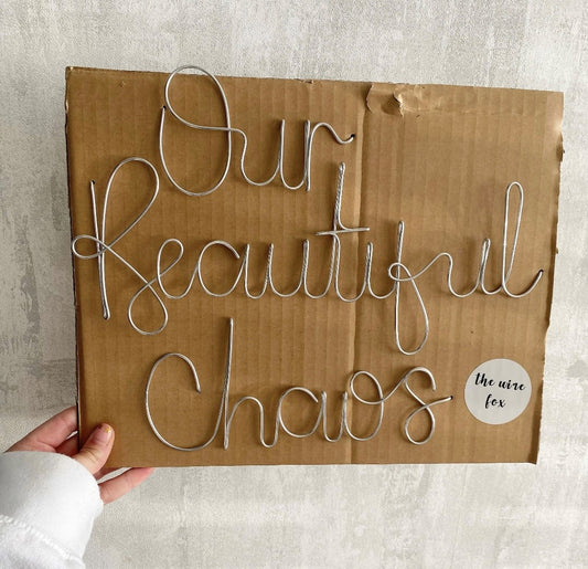 'Our Beautiful Chaos' wire sign